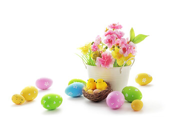 basket with colorful easter eggs and spring flowers isolated on white background - 487096562