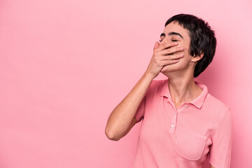 Young caucasian woman isolated on pink background laughing happy, carefree, natural emotion.