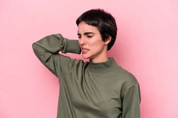 Young caucasian woman isolated on pink background tired and very sleepy keeping hand on head.