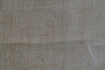 Fototapeta na wymiar New hemp fabric or hemp canvas. Sustainable and environmentally friendly textile. Copy space.