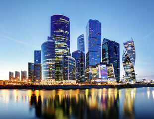 Plakat Moscow City skyline. International Business Centre at night time with Moskva river.
