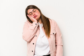 Young caucasian overweight woman isolated on white background who is bored, fatigued and need a relax day.