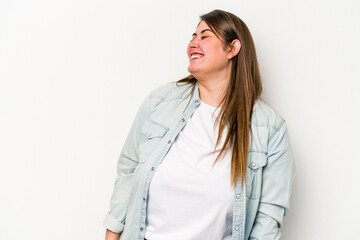 Young caucasian overweight woman isolated on white background relaxed and happy laughing, neck stretched showing teeth.