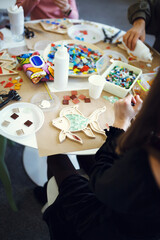 The process of creating a fish from a mosaic. 