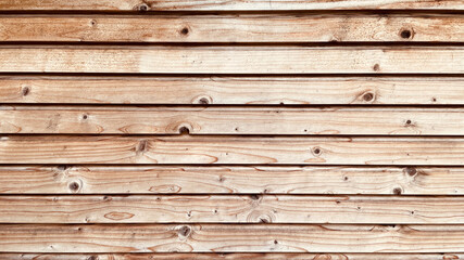 Weathered Wooden background made of thin planks. Light wood boards in a row. Can be used as a backdrop and overlay. Eco-friendly material for carpenters and builders.