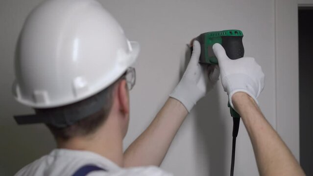 Construction puncher. Professional green electric perforator drill.