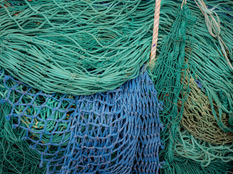 Blue and green Fishing nets on a quayside