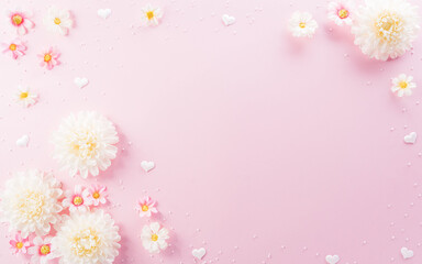 Happy Women's Day decoration concept made from flowers on pink pastel background.