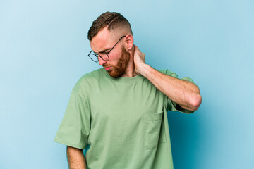 Young caucasian man isolated on blue background having a neck pain due to stress, massaging and touching it with hand.