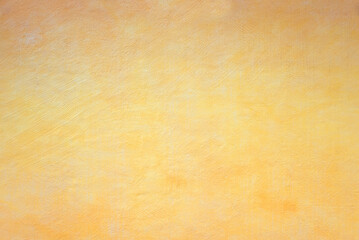 concrete wall structured with spatula technique, light yellow and orange color