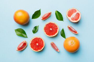 fresh Fruit grapefruit with Juicy grapefruit slices on colored background. Top view. Copy Space. creative summer concept. Half of citrus in minimal flat lay with copy space