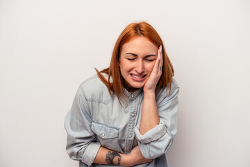 Young caucasian woman isolated on white background laughs happily and has fun keeping hands on...