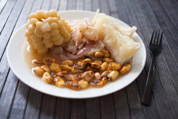 Peruvian traditional dish.fish ceviche with yuka and corn