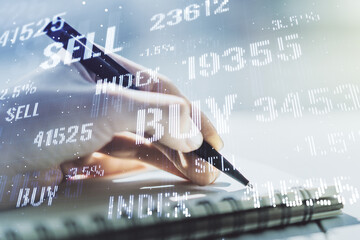 Multi exposure of abstract creative financial graph with hand writing in notepad on background, forex and investment concept