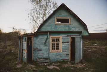 Fototapeta na wymiar an old rustic country house of blue color