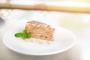 Honey cake slice on white plate