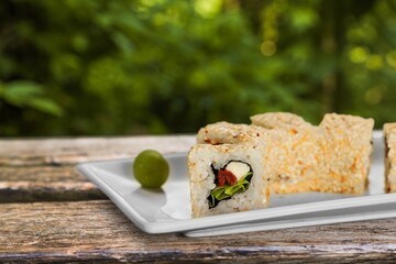 Tasty fresh sushi roll on the desk