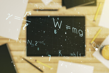 Double exposure of creative scientific formula concept and digital tablet on background, top view, research and development concept