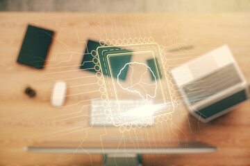 Creative artificial Intelligence concept with human brain hologram on modern laptop background....