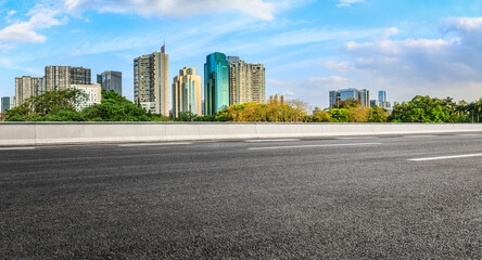 Fototapeta na wymiar Asphalt road and city skyline with modern commercial buildings in Shenzhen, China.