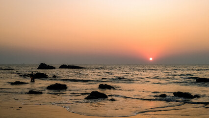 Fototapeta premium Stunning sunset at the sea in India. Arambol, GOA.