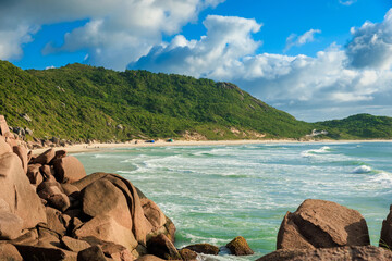 Praia da Galheta beach with amazing rocks and ocean waves. Tropical beach in Brazil