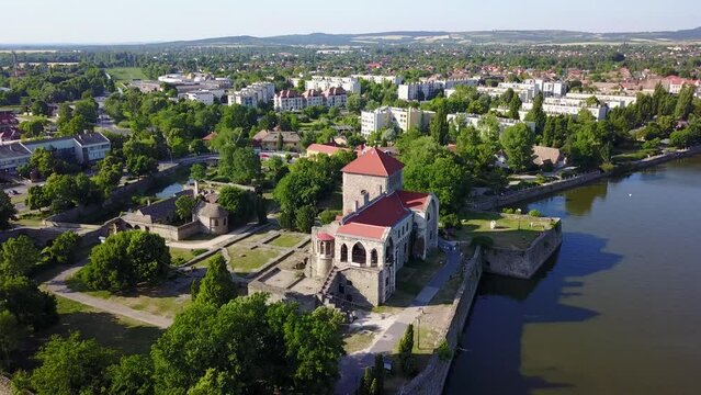 Cinematic 4K aerial drone footage of the charming historic medieval Tata Castle and &Ouml;reg lake in Kom&aacute;rom-Esztergom county Hungary