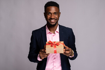 african man holding a present