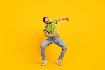 Full length photo of young cheerful man dance have fun clubber look empty space isolated over...