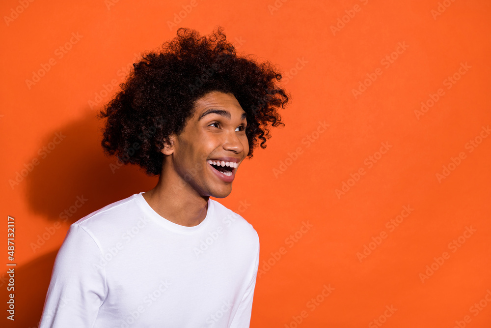 Wall mural profile side photo of young guy laughing humorous look empty space isolated over orange color backgr