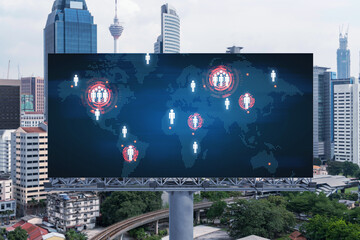 World planet Earth map hologram on billboard over panorama city view of Kuala Lumpur, Malaysia, Asia. The concept of international connections and business.