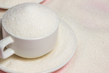 Overflowing cups with sugar on a pink background. Excessive sugar intake