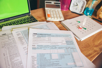 Planning Budget and Tax Concept.Calendar 2022, calculator, and Individual Income Tax Form For who...