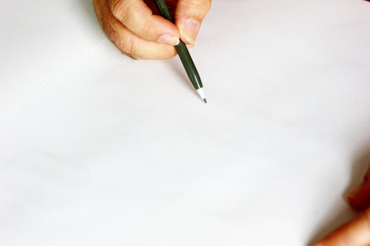 the painter drawing on white paper