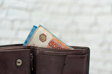 Pile of cash, paper money in a purse