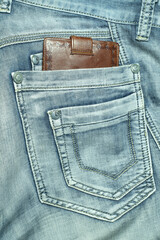 Wallet in jeans pocket, smart phone in jeans pocket