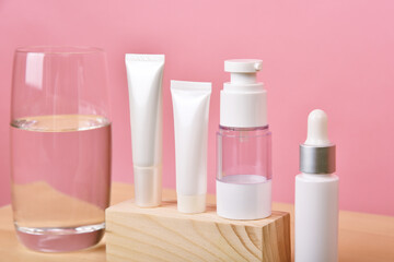 Cosmetic bottle container on pink background, Blank label for branding mock-up.