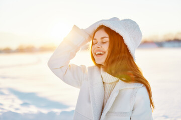 woman red hair snow field winter clothes Sunny winter day Fresh air