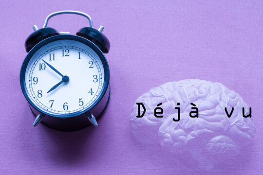 Time is concept. Brain and text with the words d&eacute;j&agrave; vu. 