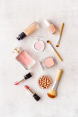 Fototapeta na wymiar Flat lay of decorative makeup cosmetic products, top view