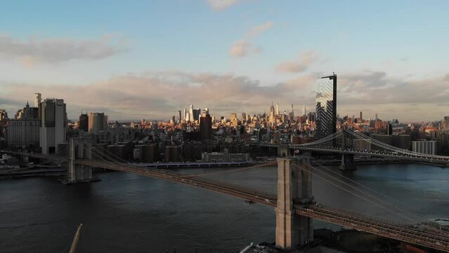 Smooth 4K Drone video in New York city at Brooklyn bridge during sunset. 
30fps - 4K un-edited clip.
Filmed in December 2021 around 5pm.