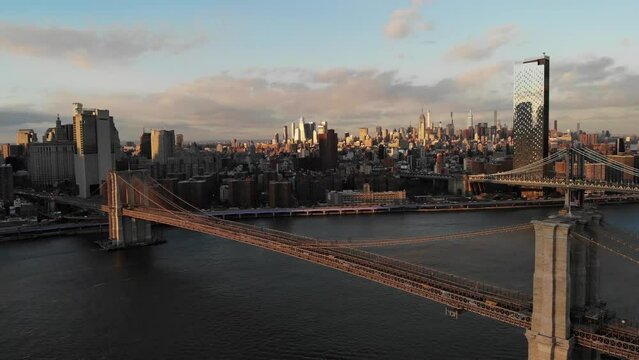 Smooth 4K Drone video in New York city at Brooklyn bridge during sunset. 
30fps - 4K un-edited clip.
Filmed in December 2021 around 5pm.