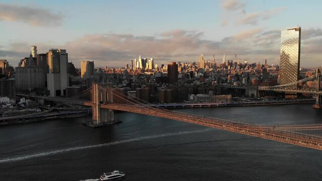 Smooth 4K Drone video in New York city at Brooklyn bridge during sunset. 
30fps - 4K un-edited clip.
Filmed in December 2021 around 5pm.