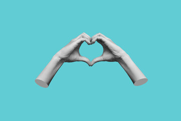 Human female hands showing a heart shape isolated on a blue color background. Feelings and...
