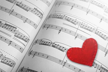 Small red heart with musical notes