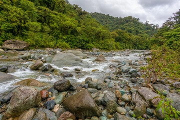 Fototapeta na wymiar The Orosi River, also called Rio Grande de Orosi, is a river in Costa Rica near the Cordillera de Talamanca. Tapanti - Cerro de la Muerte Massif National Park. Costa Rica wilderness landscape