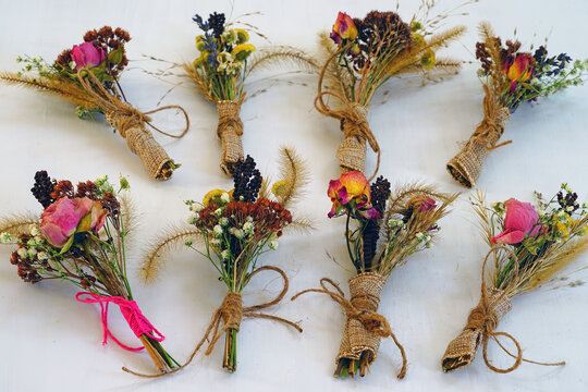 Mini dried flower bouquets tied with twine