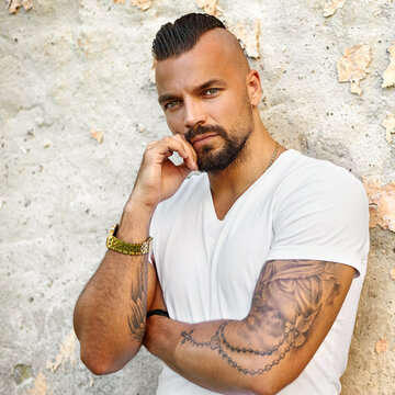 Stylish bearded elegant man outdoor fashion portrait. Close up