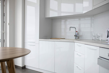 Fototapeta na wymiar Modern kitchen, white built-in appliances interior.