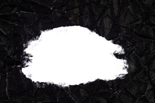 Ripped crumpled black paper with space